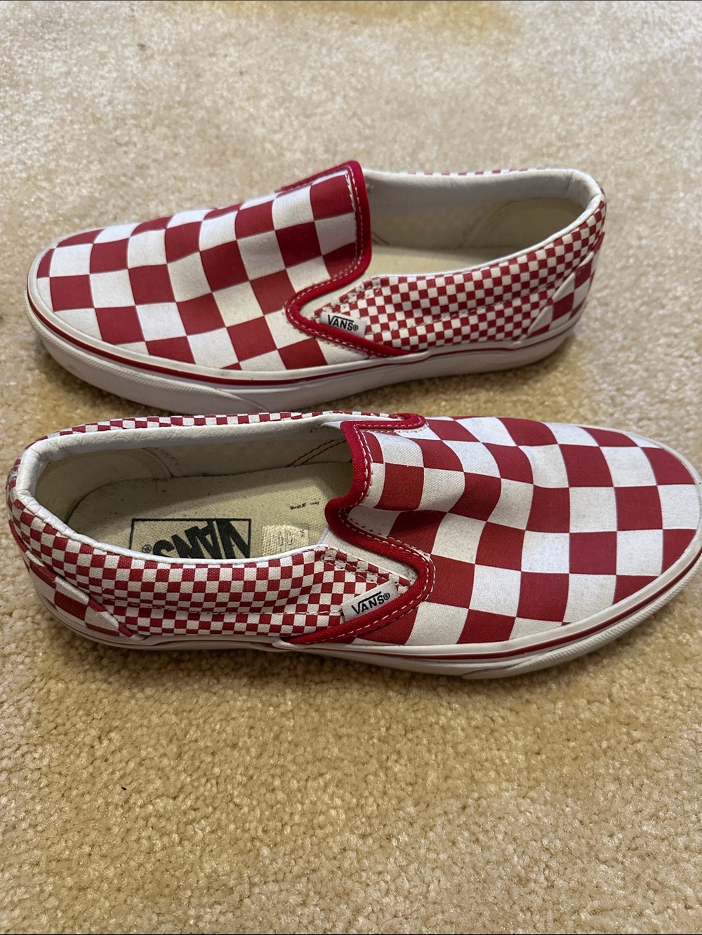 Vans women’s Red and White Checkerboard Slip-On Sneakers